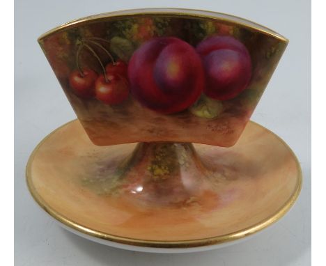 A Royal Worcester cigarette holder, decorated all around with fruit to a mossy background by H Ayrton, dated 1938, height 3in