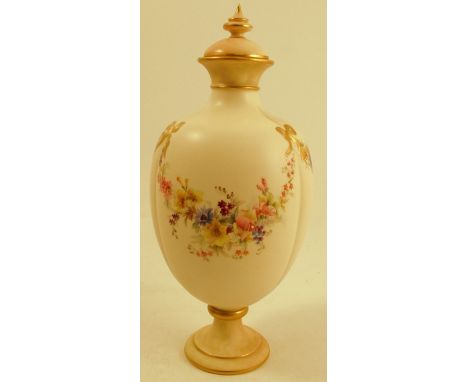A Royal Worcester gilded ivory covered vase, with blush ivory cover and pedestal, decorated with a band of flowers and gilt r