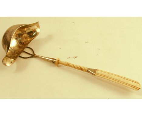 A 19th century ladle, with carved bone handle the double lipped bowl engraved with initials, length 12ins