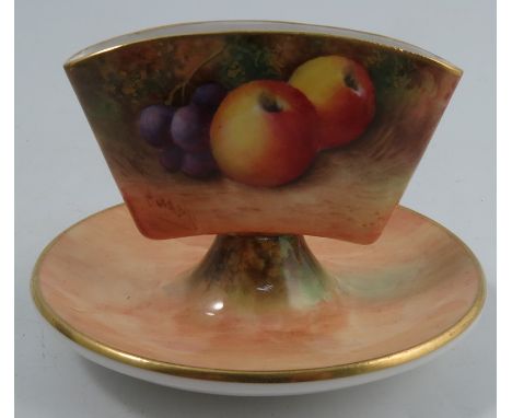 A Royal Worcester cigarette holder, decorated all around with fruit to a mossy background by Moseley, dated 1938, height 3ins