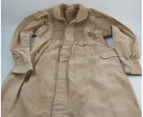 A 19th century Oxfordshire farm workers smock, with button through front, smocking front and back and stitched decoration, ha