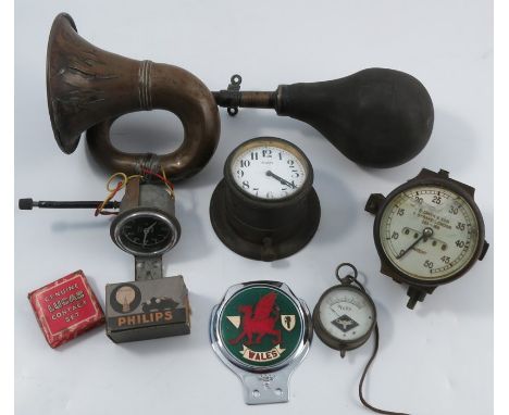 A collection of vintage motoring parts, to include a brass horn with rubber bulb and bracket, stamped B2281, a brass cased S 