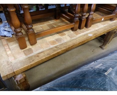 A TILE TOP COFFEE TABLE.