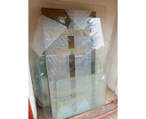 A LARGE QUANTITY OF PLANE GLASS TABLE TOPS AND SHELVES