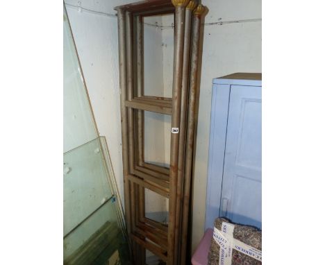 A SET OF FOUR IRON AND BRASS MOUNTED SHELF SUPPORTS