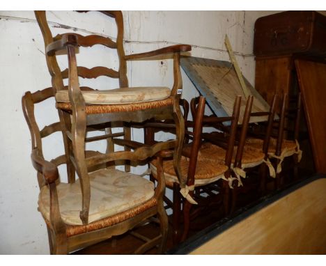 A SET OF EIGHT RUSH SEAT FRENCH LADDER BACK CHAIRS 