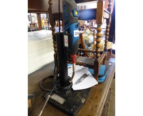 A ROTARY POWER TOOL WITH STAND.