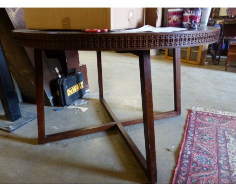 A MODERN HARDWOOD CENTRE TABLE.