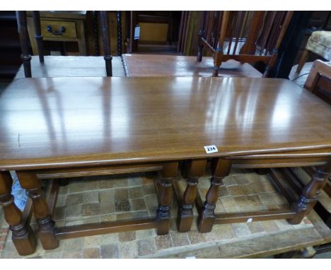 AN ERCOL NEST OF COFFEE TABLES.