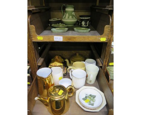 A Wedgwood green jasperware jug, 15cm high, three trinket trays, two black jasperware boxes and a vase, various other teaware