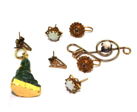 Three pairs of earrings to include an opal pair, a small carved Buddha and a gold colour treble clef