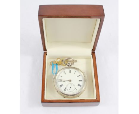 A silver key wind pocket watch with white enamel dial complate with key