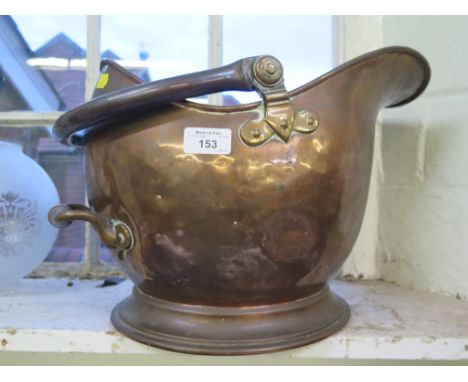 A copper coal helmet, and a brass and glass oil lamp (2)