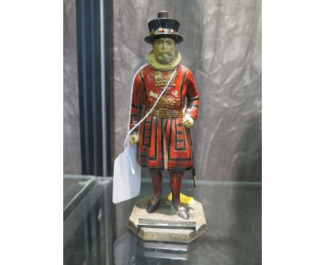 A painted metal table lighter in the form of a Yeoman of the Guard, 16.5cm high