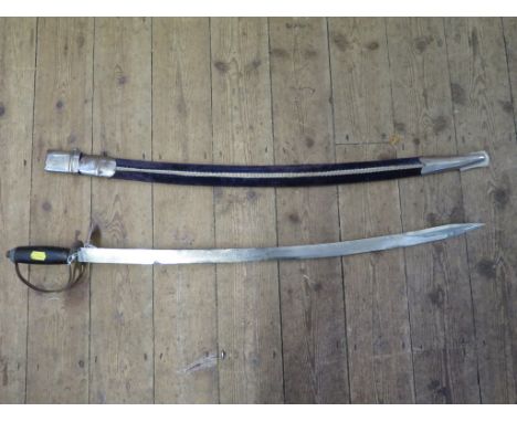 An Indian sword, with engraved blade and velvet covered scabbard, length of blade 74cm