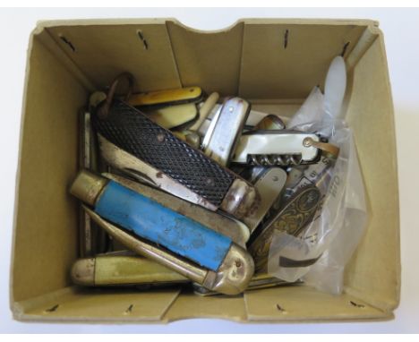 A collection of penknives and button hooks, some with mother of pearl