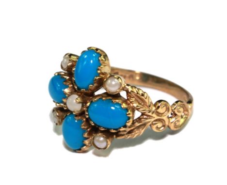 A reproduction turquoise and pearl ring set in 9 carat gold