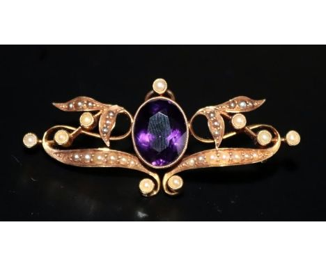 15ct Gold Victorian Pendant/Brooch Set With A Central Amethyst Between Numerous Seed Pearls In A Floral Design, Stamped 15ct,