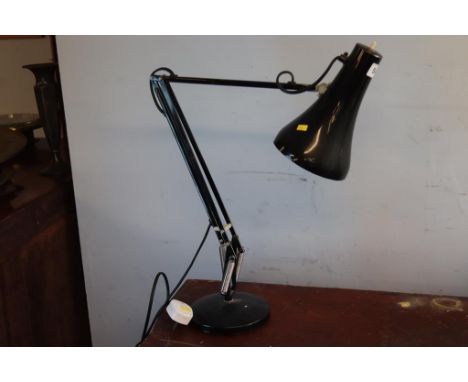A black angle poise lamp
