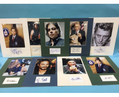 Assorted mounted photos and signed cards, to include Kurt Russell, Kirk Douglas, Lloyd Bridges, Buddy Hackett, Benjamin Bratt