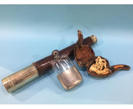 A telescope, pipe and a hip flask