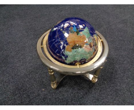 A Gemstone globe on stand, height 30 cm.  