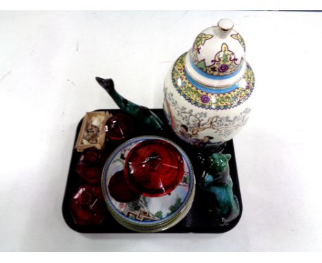 A tray containing 20th century oriental lidded vase on stand, weighed tortoises, collector's plates, red glassware including 