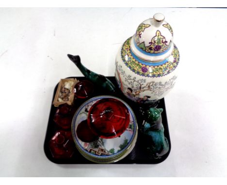 A tray containing 20th century oriental lidded vase on stand, weighed tortoises, collector's plates, red glassware including 