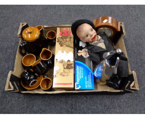 A box containing ventriloquist's doll, soda siphon, glazed pottery tea set, mantel clock etc. 