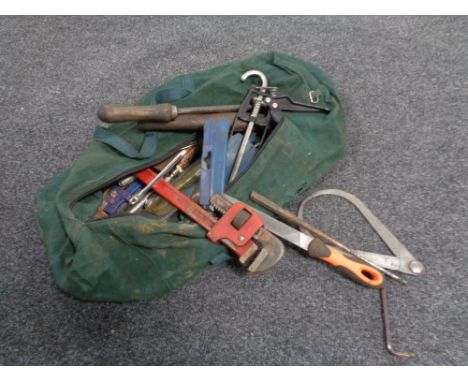A toolbox and bag containing various tools including wrenches, spanners, socket set etc. 