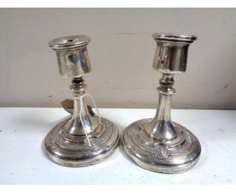 A pair of silver candlesticks of Celtic design, height 11 cm. (2) 