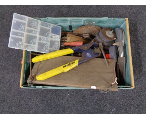 A box containing a large quantity of assorted hand tools, grinding disks, circular saw blades etc.  