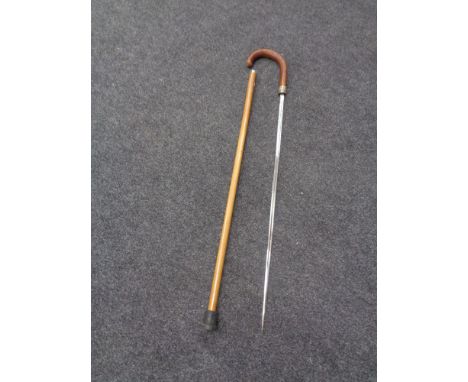 A silver mounted sword stick with etched single fullered blade signed Wilkinson, Pall Mall.  