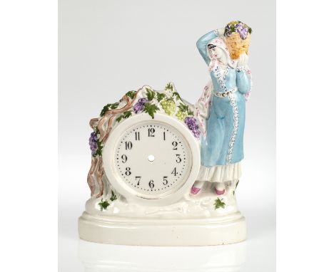 A RUSSIAN PORCELAIN TABLE CLOCK CASE IN THE SHAPE OF A GEORGIAN WOMAN AFTER NATALYA DANKO (RUSSIAN 1892-1942), LENINGRAD PORC