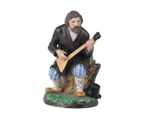 A RUSSIAN PORCELAIN FIGURE OF A BALALAIKA PLAYER, POPOV PORCELAIN FACTORY, GORBUNOVO, MID 19TH CENTURY realistically modeled 
