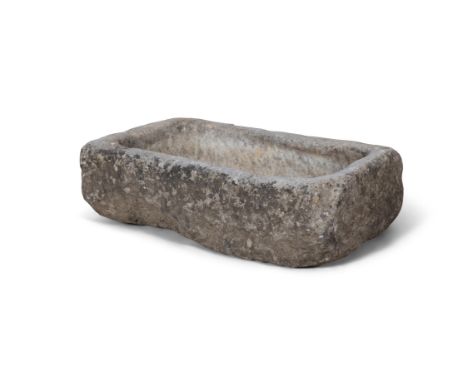 A LIMESTONE DUCK TROUGH,14cm high, 47cm wide, 27cm deep