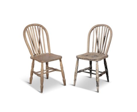 A MATCHED PAIR OF PINE CHAIRS,the stick backs and dished saddle seats on splayed turned legs with twin stretchers, 84cm high,