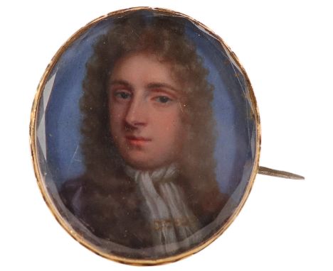 English School c.1700 Portrait miniature of a gentleman wearing a cravat and long wig On vellum, oval, in a gilt metal brooch