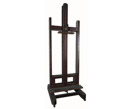 An Early 20th Century oak double-sided easel Adjustable on crank mechanism, on casters and with handle 181cm; 71¼in high (une