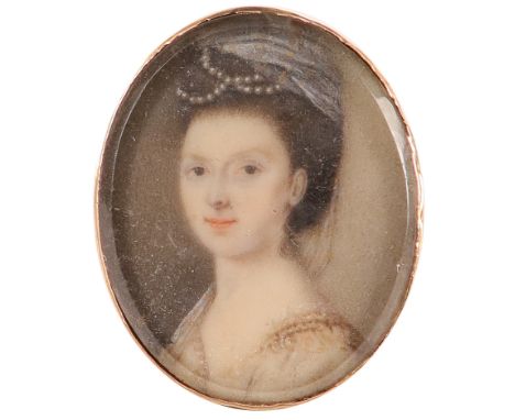 λEnglish School Mid 18th Century Portrait miniature of a lady wearing a turban and pearls in her hair Oval, in a gilt metal b