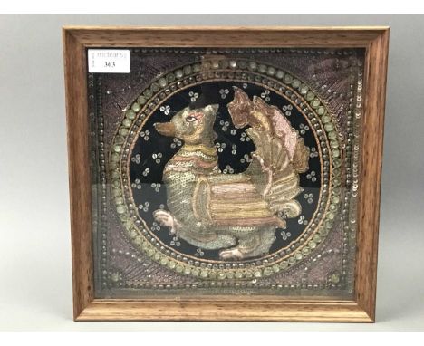 INDIAN EMBROIDERED PANEL,depicting a mythical bird, modelled in relief, framed and under glass, 28.5cm x 29.5cm overall