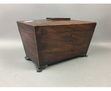 GEORGIAN MAHOGANY SARCOPHAGUS TEA CADDY,with fitted interior (lacking canister), on four later cast feet, 34.5cm wide