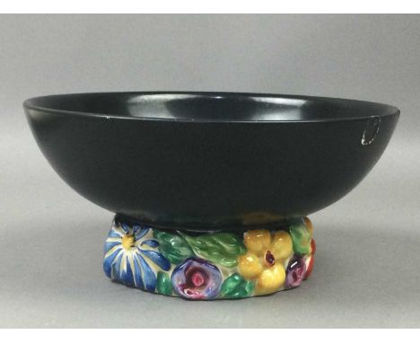 LOT OF CLARICE CLIFF CERAMICS,comprising a Bizarre cup with angular handle, a Bizarre platter, a Fantasque plate, a Royal Sta