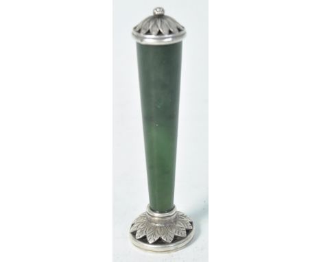 A 19th century French silver and nephrite jade wax desk seal. The seal of elliptical form depicting heraldic swags, beasts an