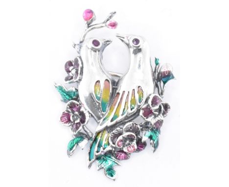 A silver and enamel brooch featuring a pair of love birds sat amidst roses. Marked 925 to the verso. Measures 35mm in length.