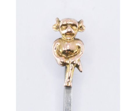 A vintage 20th Century white metal bar brooch having a gold finial in the form of the Lincoln Imp. White metal unmarked, imp 