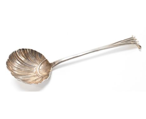A George III silver hallmarked ladle having a scallop shell moulded bowl and scrolled handle. Hallmarked London 1780. Makers 