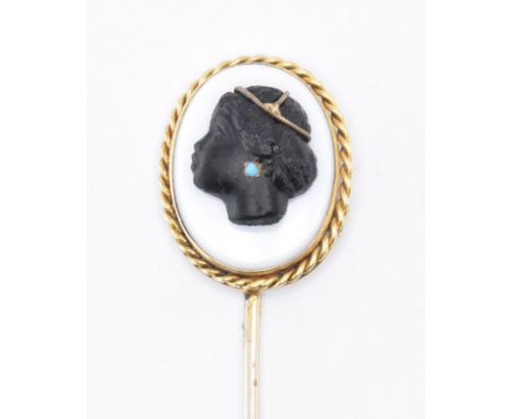 A 19th Century Victorian gold stick pin having a carved oval cameo panel finial to the top. The cameo depicting a black femal