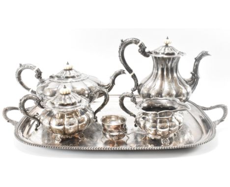 A 1960s silver hallmarked Barker Ellis Silver Company tea set. The set having gadrooned bodies with scrolled acanthus leaf ha