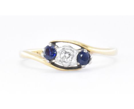 A 1920s Art Deco 18ct gold and platinum, diamond and sapphire three stone cross over ring. The antique ring being illusion se